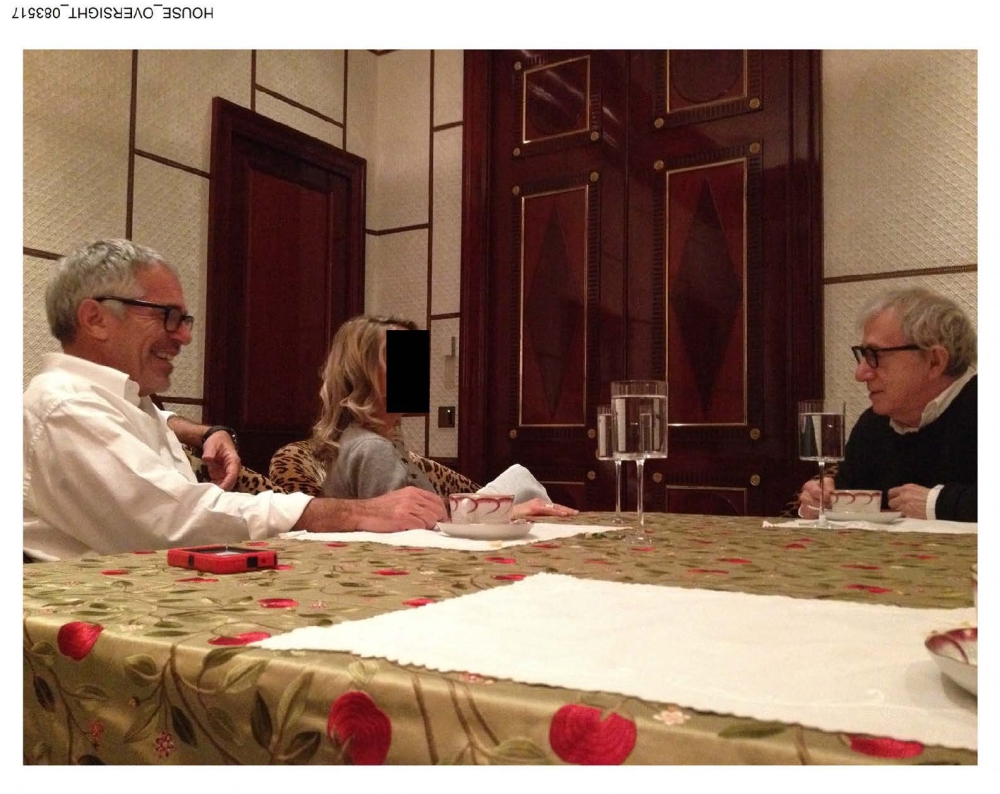 Undated photo from Jeffrey Epstein’s estate shows the late financier (left) and filmmaker Woody Allen (right) talking with a woman whose face is redacted; released by House Oversight Democrats on December 12, 2025. — Handout photo from House Oversight Democrats via AFP