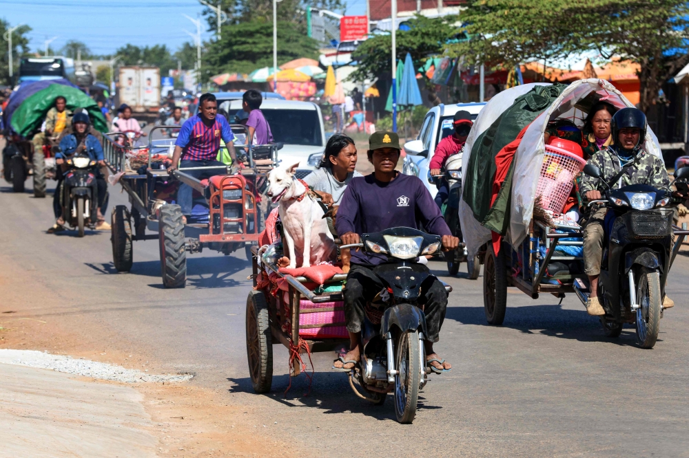 Residents evacuate following airstrikes in Siem Reap province amid Cambodia–Thailand border clashes, December 15, 2025. — Handout photo by Agence Kampuchea Press via AFP