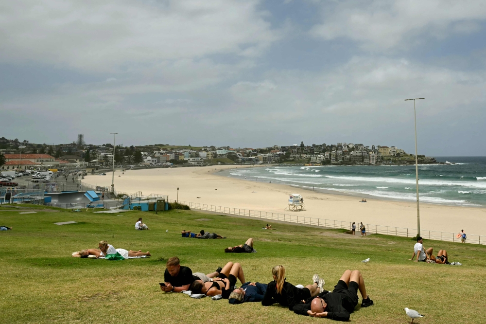 People are seen at Bondi Beach in Sydney on December 15, 2025, a day after the shootings. — AFP pic