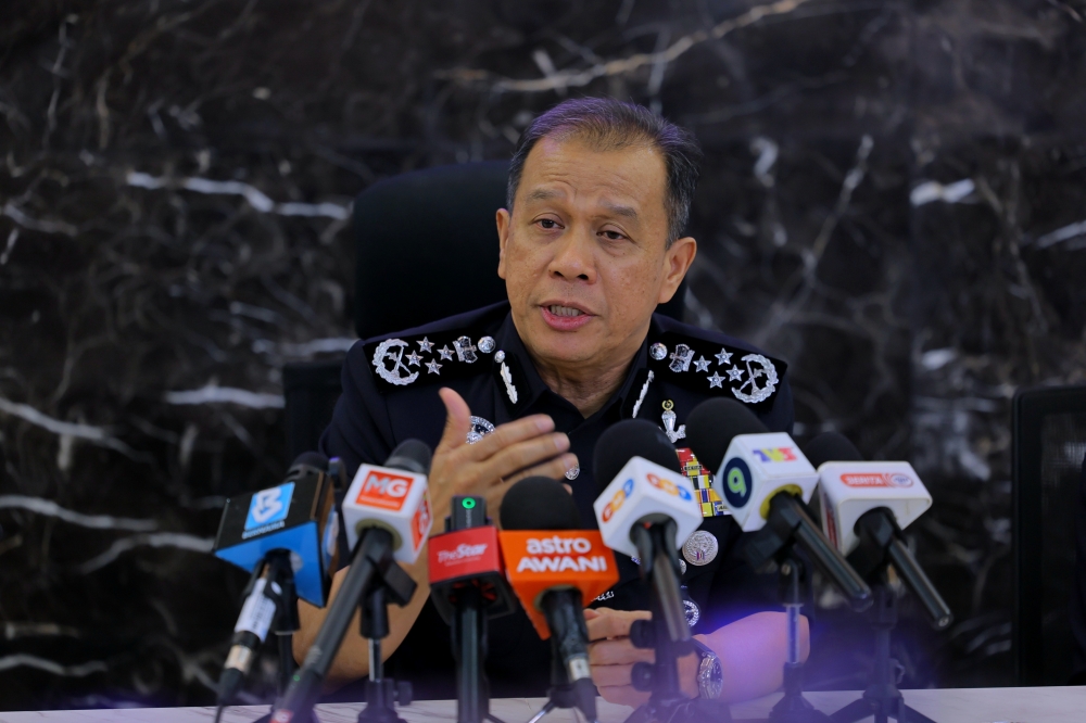 Inspector-General of Police Datuk Seri Mohd Khalid Ismail attends a press conference at Dewan Merdeka in the World Trade Centre, Kuala Lumpur on Oct 14, 2025. — Bernama pic