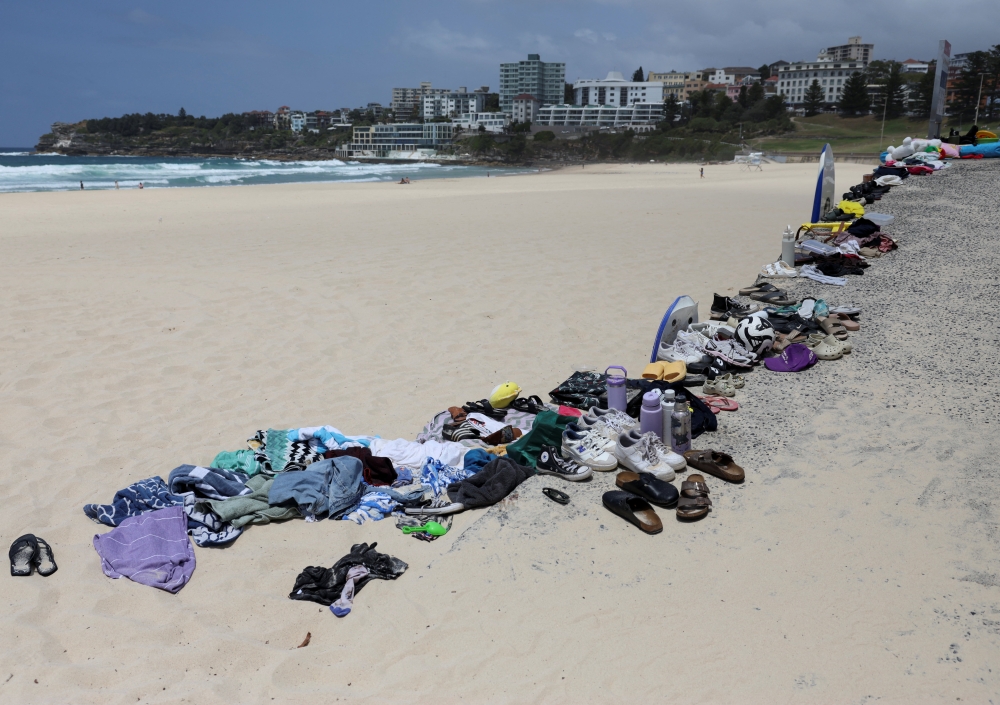 Belongings left behind by people are gathered at the beach near the scene of a shooting on a Jewish holiday celebration at Bondi Beach, in Sydney December 15, 2025. — Reuters pic  
