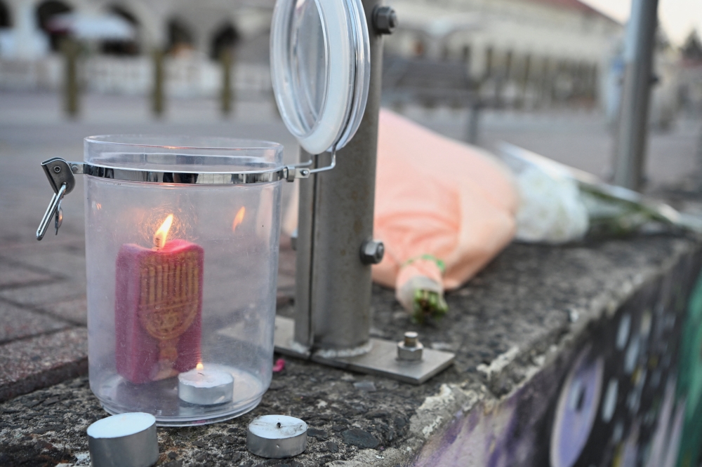 Candles burn following the attack on a Jewish holiday celebration at Sydney's Bondi Beach, in Sydney December 15, 2025. — Reuters pic  