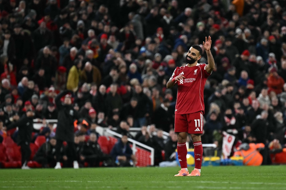 Liverpool’s Mohamed Salah applauds fans after his side’s 2-0 Premier League win over Brighton at Anfield on December 13, 2025. — AFP pic