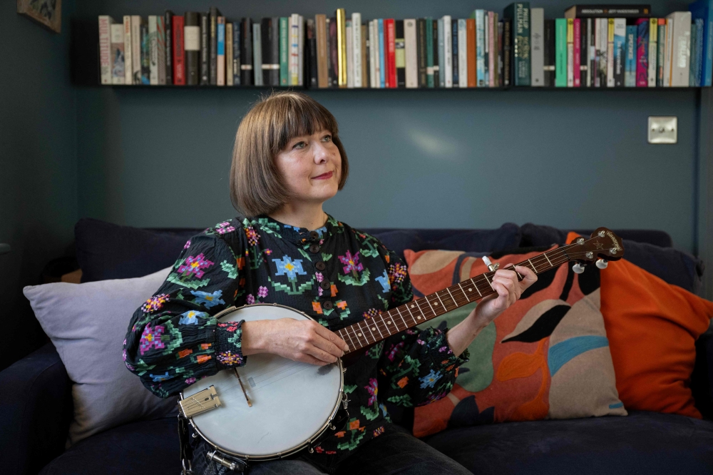 Folk singer Emily Portman, who found a counterfeit potentially AI-generated album purporting to be created by her online, poses for a photograph in Sheffield, northern England. — AFP pic