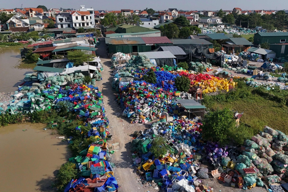 An aerial photo taken on November 25, 2025, shows sprawling piles of plastic waste in a village on the outskirts of Hanoi. — AFP pic