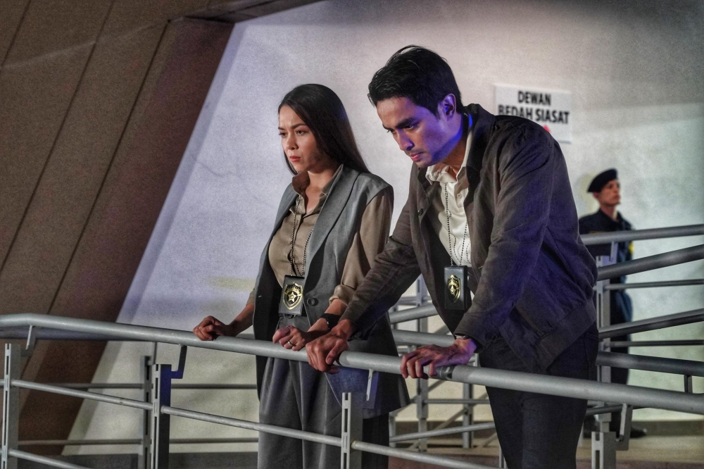 Aiman Hakim as Emir Khalid with Siti Saleha, who plays Hana — Chief of Police and Emir’s wife — in ‘Bad Cop’. — Picture courtesy of Astro Shaw
