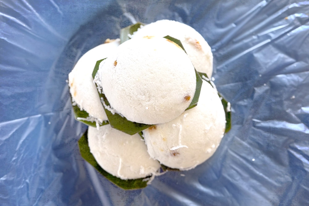 A pile of just made 'putu piring' ready for packing. — Picture by CK Lim