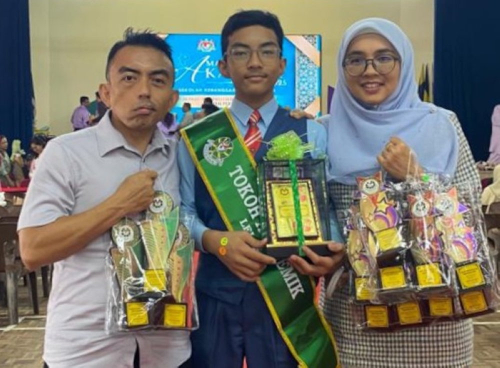The author (left) with his youngest son, Yusuff, at this year’s prize-giving ceremony. — Picture by Nahrizul Adib Kadri