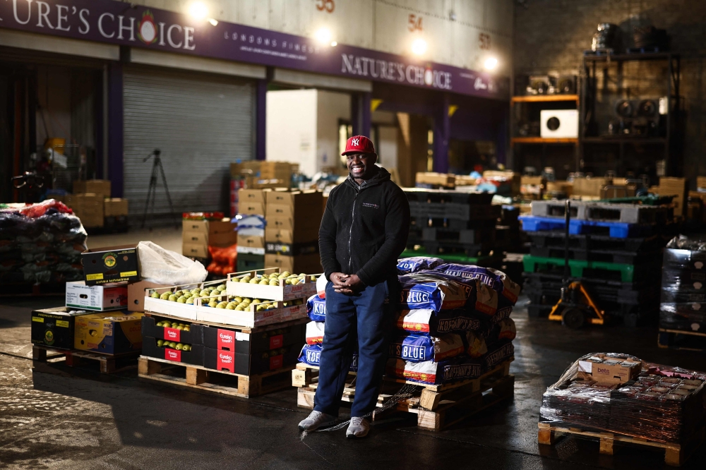 Leandro Cristovao, 36, packages wholesale produce which reaches UK restaurants, schools and hotels in the early morning hours. — AFP pic