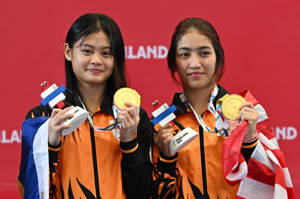 Malaysia celebrates first SEA Games diving gold, courtesy of Nur Eilisha Rania Muhammad Abrar Raj and Nurul Farisya Alia Affendi. — Reuters pic