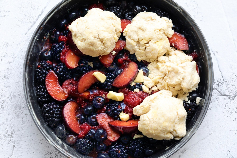 Place the buttermilk biscuit dough over the fruit filling. — Picture by CK Lim