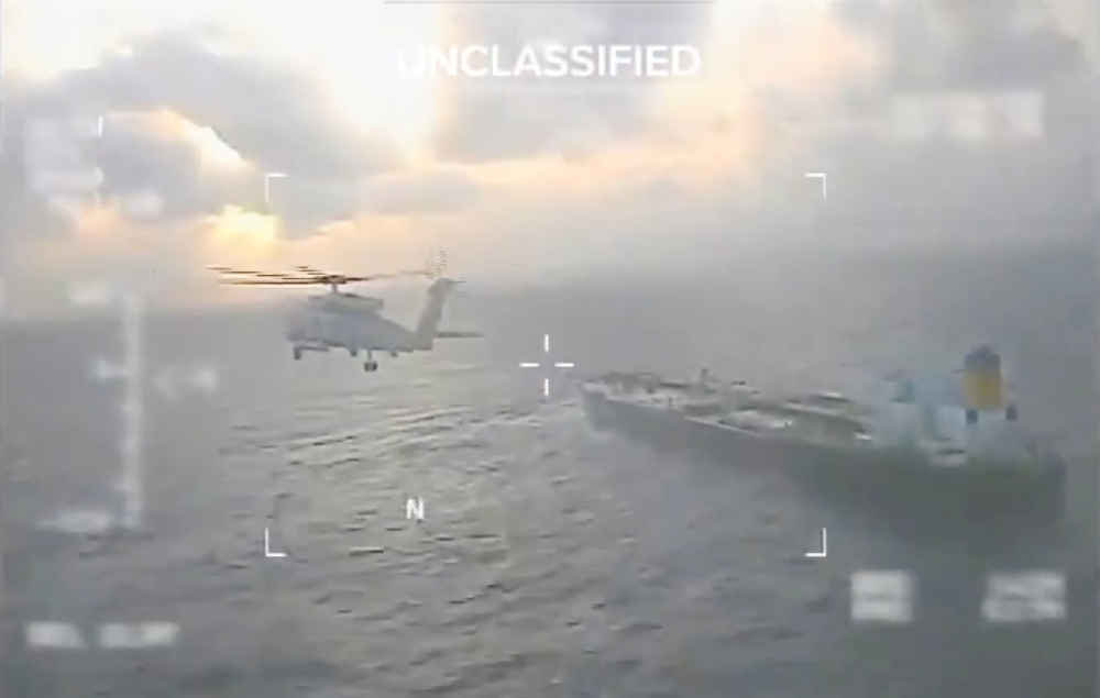 This screen grab taken from a video posted on the X account of US Secretary of Homeland Security Kristi Noem shows a US Coast Guard aircraft flying over a crude oil tanker, last docked in Venezuela, before apprehending it on December 20, 2025. — AFP pic