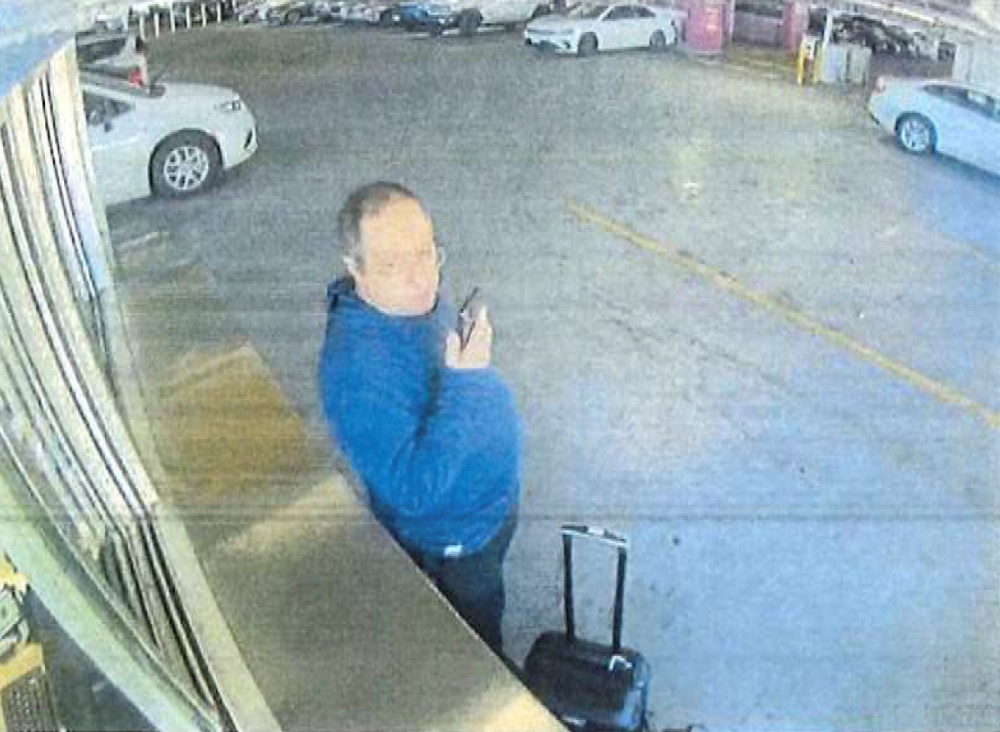 Claudio Neves Valente, suspect in the Brown University shooting in Providence, Rhode Island, picks up a vehicle at an Alamo Rent a Car in this frame grab from CCTV released in an affidavit by the Providence Police December 18, 2025. — Providence Police/Handout via Reuters