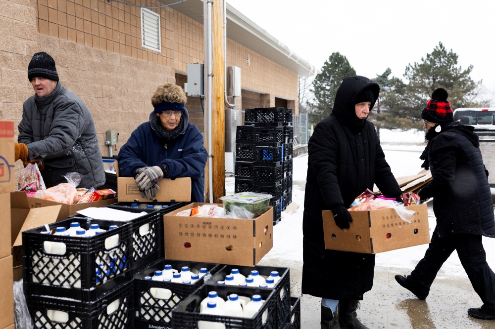 Long lines at the food pantry: Inflation tests Trump’s base in Michigan as Senate race looms