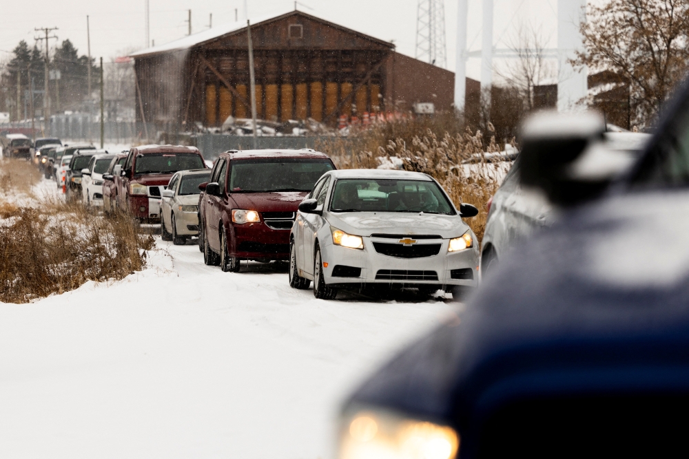 People arrive in vehicles for a mobile pop-up food pantry providing free groceries to local families in need at Mussey Fire Hall in Capac, Michigan December 9, 2025. — Reuters pic 