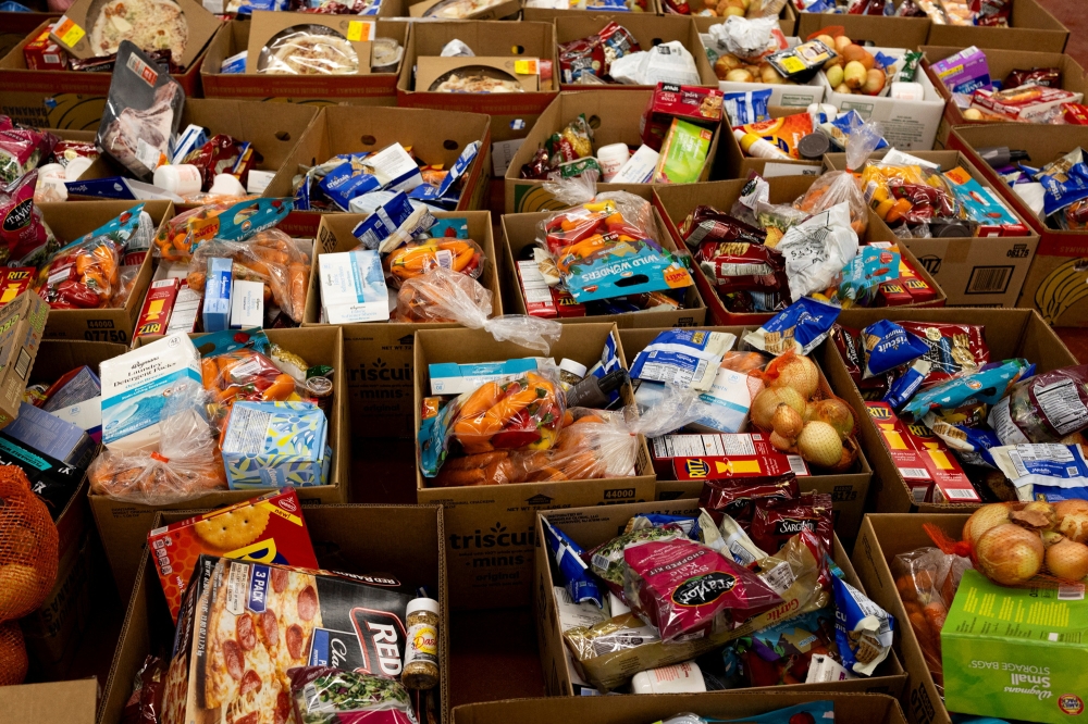 Packaged food items arranged in boxes ahead of a mobile pop-up food pantry providing free groceries to local families at Mussey Fire Hall in Capac, Michigan December 9, 2025. — Reuters pic 