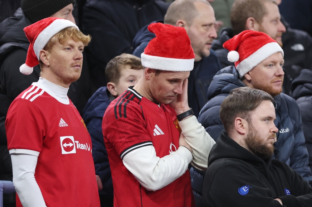 Manchester United fans look dejected during the Premier League match against Aston Villa at Villa Park in Birmingham, Britain on December 21, 2025. — Reuters pic