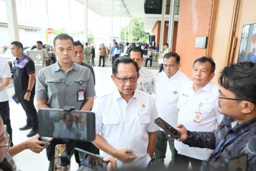 Indonesian Home Affairs Minister Tito Karnavian (centre) has come under scrutiny for pushing self-reliance first in disaster management amid floods and landslides wrecking his country. — Picture from Facebook/Tito Karnavian