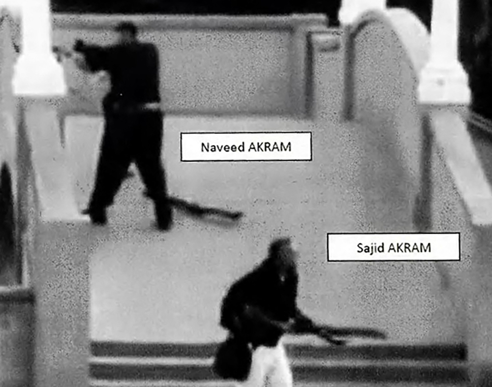A handout photo released by the New South Wales Courts on December 22, 2025, shows Sajid and Naveed Akram allegedly shooting towards a crowd at Archer Park in Bondi Beach, Sydney on December 14, 2025. — AFP pic