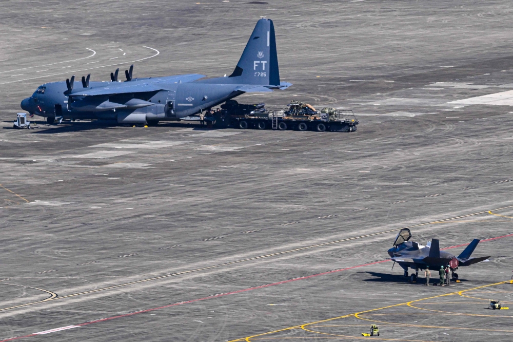 A US Air Force C-130 Hercules and a US Air Force F-35A fighter jet sit on the tarmac at the José Aponte de la Torre Airport in Ceiba, Puerto Rico on December 20, 2025. — AFP pic