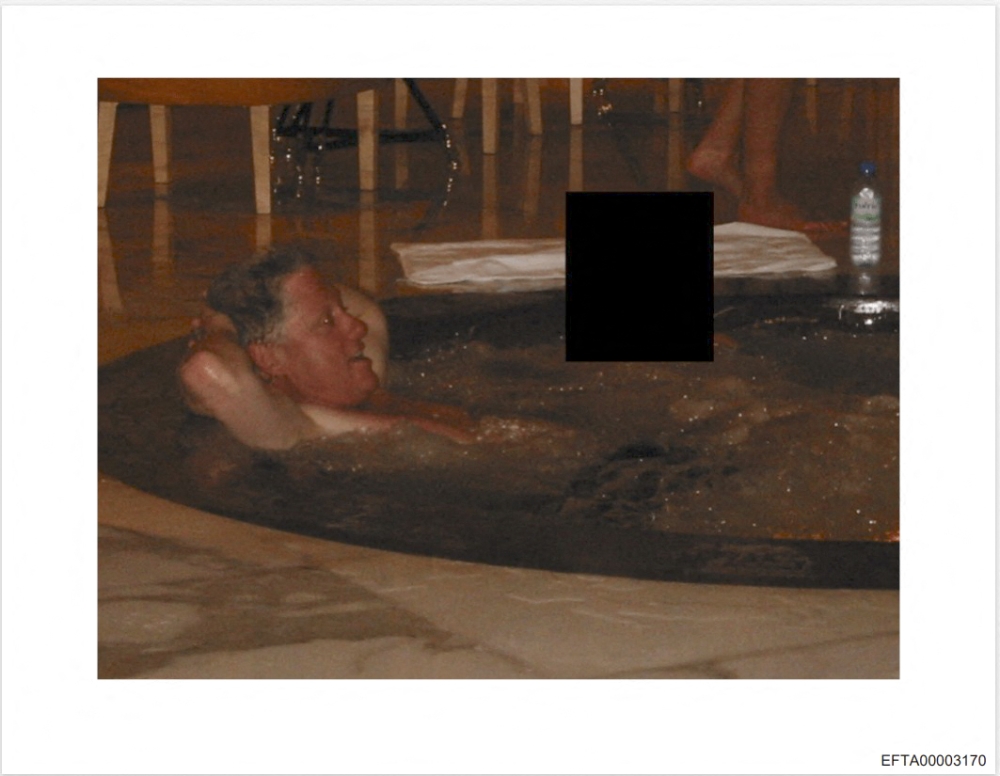 This photo provided by the US Justice Department on December 19, 2025 shows an undated picture of former US president Bill Clinton in a jacuzzi at an undisclosed location as the Justice Department began releasing the long-awaited records from the investigation into the politically explosive case of convicted sex offender Jeffrey Epstein. — AFP pic