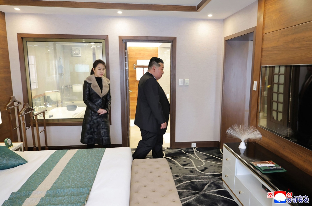This picture taken on December 20, 2025 and released by North Korea's official Korean Central News Agency (KCNA) via KNS on December 23, 2025 shows North Korean leader Kim Jong Un (R) and his daughter Ju Ae inspecting the Ikkal Hotel, which was recently completed in the Samjiyon tourist district of Ryanggang Province. — AFP pic
