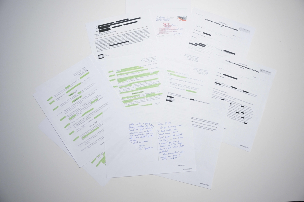 This photo illustration taken in Washington, DC, on December 23, 2025 shows a new batch of files released on Tuesday by the US government in relation to the notorious late sex offender Jeffrey Epstein. — US Justice Department handout/AFP pic