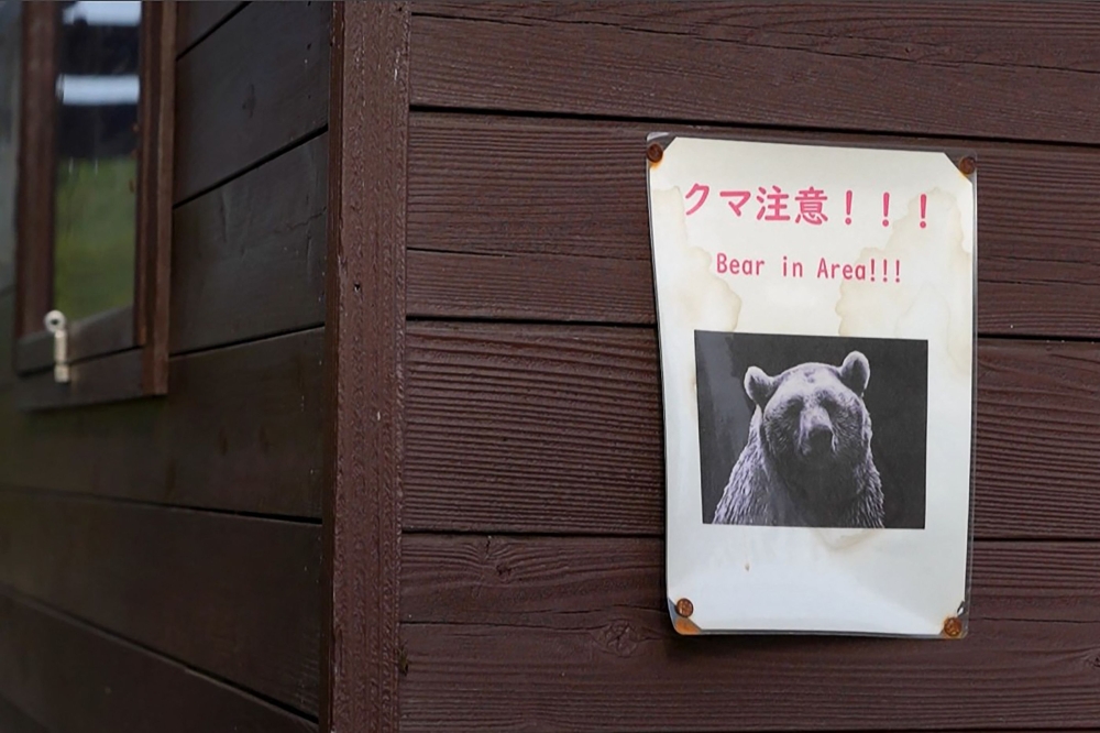 A ‘Bear in Area’ warning sign displayed near a forest in Akita Prefecture. Since Japan recorded a spike in deadly bear attacks, Koji Suzuki has struggled to keep up with booming demand for grilled cuts of the animal at his restaurant. — AFP pic