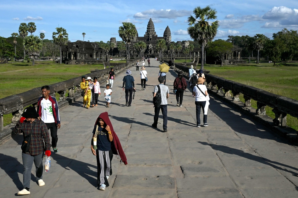 Tourists visit the Angkor Wat temple in Siem Reap province December 18, 2025. — AFP pic