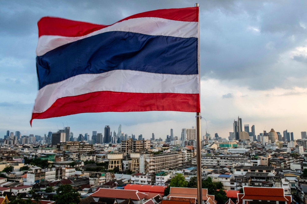 Thailand’s national flag flies over the city skyline in Bangkok on October 28, 2024. — AFP pic