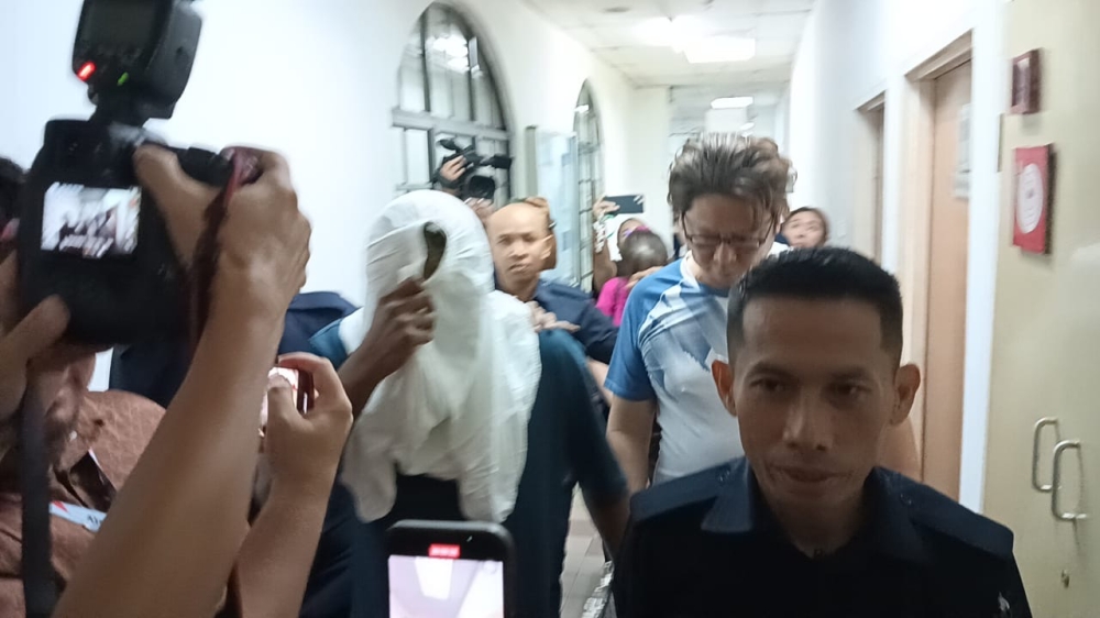 After viral brawl in JB mall and police station, Singaporean part-time actor and family of three charged