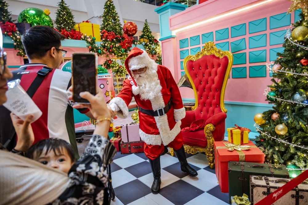 A man dressed as Santa Claus is seen on Christmas Eve at MyTown Shopping Centre in Kuala Lumpur December 24, 2025. — Picture by Firdaus Latif