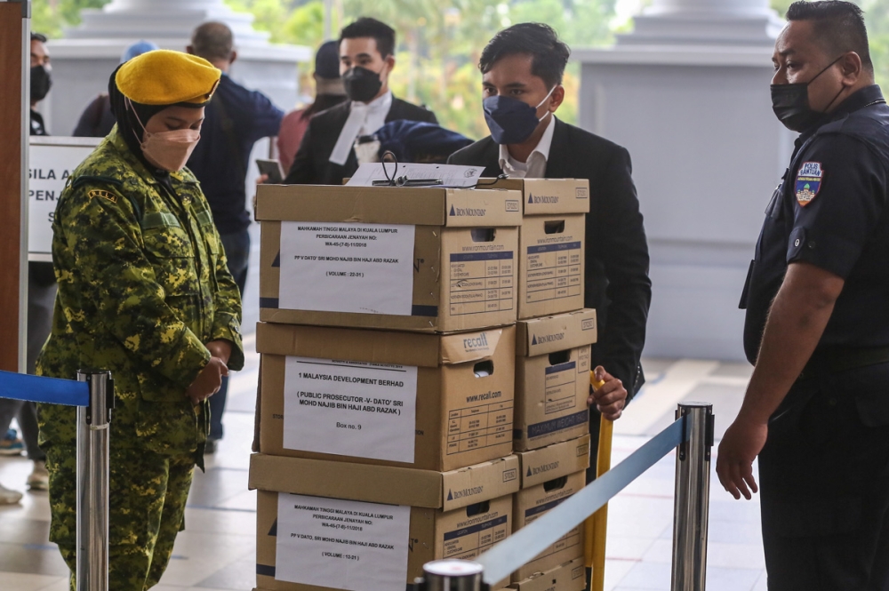 Datuk Seri Najib Razak’s 1MDB trial involved huge volumes of documents and evidence including bank documents, as seen here in boxes brought to the Kuala Lumpur court complex for the trial on January 26, 2022. — Picture by Yusof Mat Isa