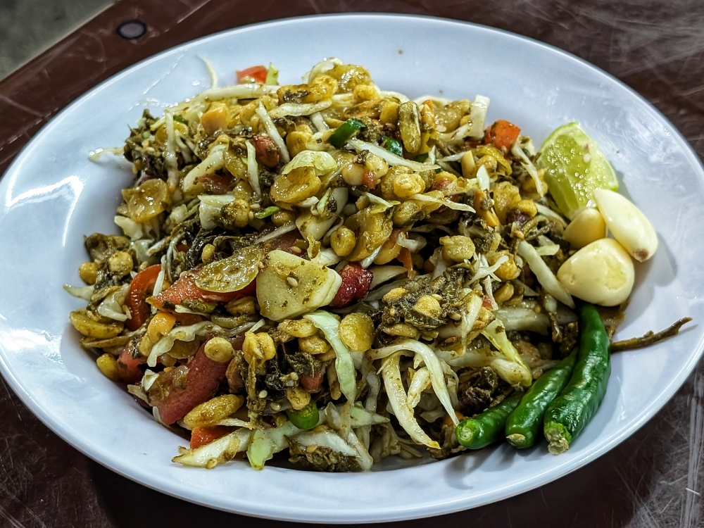 ‘Lahpet thoke’, Myanmar’s iconic fermented tea leaf salad, from an unassuming stall in Desa Sri Hartamas — Picture by Ethan Lau