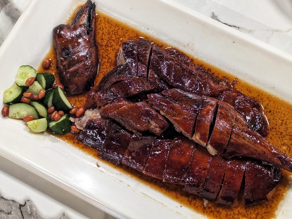Few things in the world are more tantalising than the appearance of an entire roasted goose, like the one here from Hong Kong Roasted Goose King — Picture by Ethan Lau