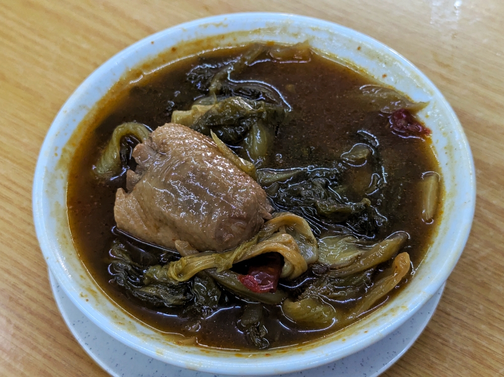 Braised duck might seem like the calling card at Ah Sang, but the real star of the show is the ‘assam’ mustard greens — Picture by Ethan Lau