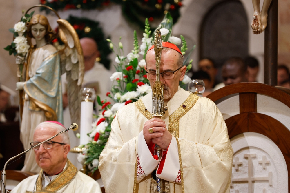 Acting Latin Patriarch of Jerusalem Pierbattista Pizzaballa leads a Christmas Midnight Mass at Saint Catherine’s Church in the Church of the Nativity in the Israeli-occupied West Bank city of Bethlehem on December 24, 2025. — AFP pic