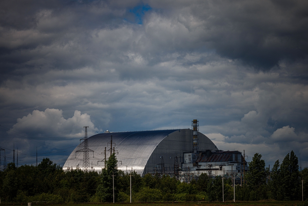 The New Safe Confinement at Chernobyl Nuclear Power Plant which covers the number 4 reactor unit. The Chernobyl Nuclear Power Plant director said fully restoring the internal radiation shelter could take three to four years, after a hit earlier this year punched a hole in the outer radiation shell. — AFP pic