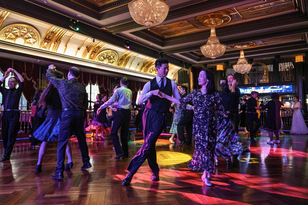 Couples dance at the Paramount Ballroom in the Jing’An district of Shanghai December 11, 2025. — AFP pic