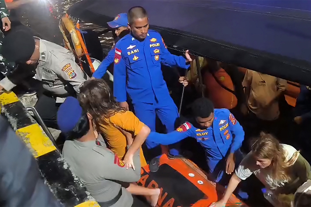 Search and rescue teams evacuate tourists after a boat sank near Padar Island, Labuan Bajo, December 27, 2025. — AFP pic/BASARNAS Labuan Bajo
