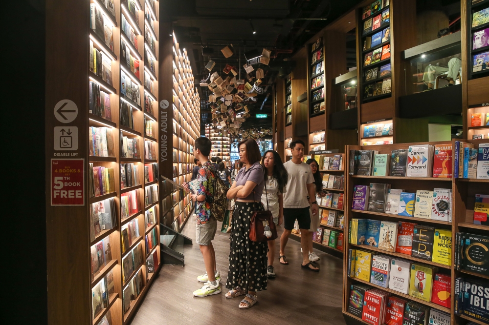 People explore the newly opened 24-hour The Library by BookXcess at the Sunway Square Mall in Petaling Jaya, Selangor. — Picture by Yusof Mat Isa