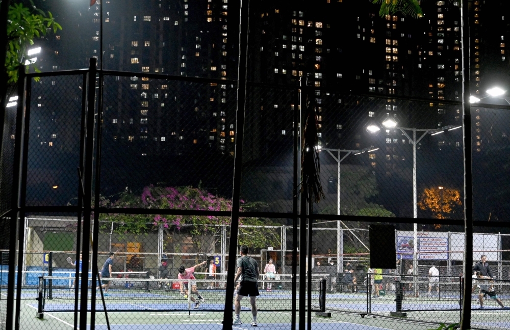 The piercing pop-pop of pickleball paddles starts before sunrise and ends after midnight at dozens of newly built courts across Hanoi, as residents relish one of Vietnam's fastest-growing sports – or rage at the noise it makes. — AFP pic