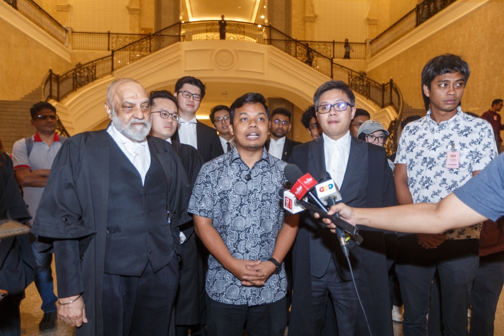 Activist Amir Hariri Abdul Hadi speaks to the media during a press conference at the Federal Court in Putrajaya after the verdict on his challenge against the legitimacy of the Peaceful Assembly Act. July 1, 2025. — Picture by Raymond Manuel
