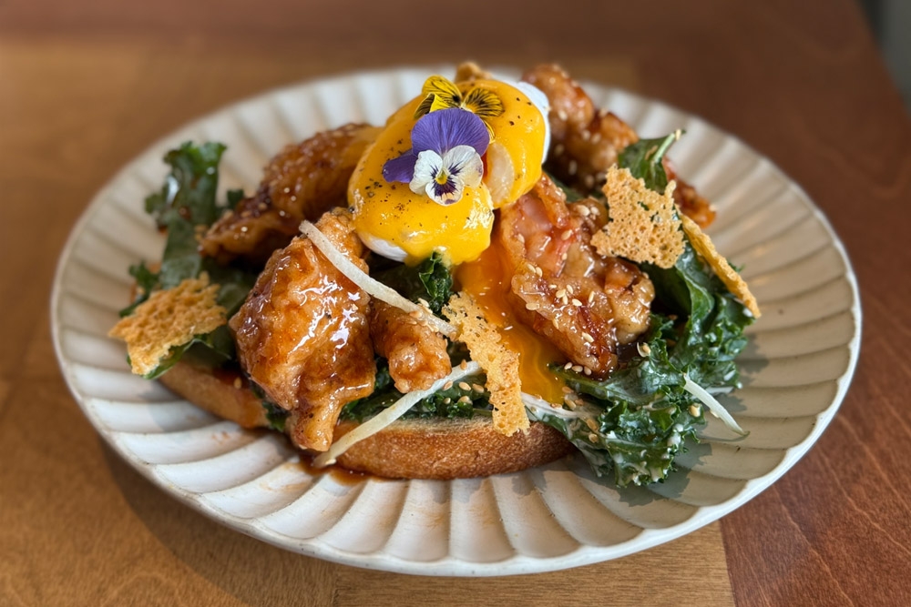 Seoul Good Fried Chicken Egg Benedict with Kale Salad. — Picture by CK Lim