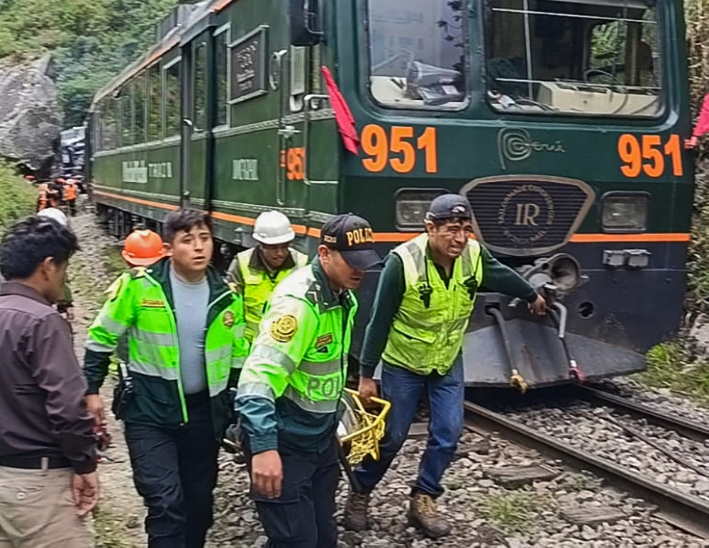 Police officers carry an injured passenger from one of the two trains affected after a head-on collision connecting Machu Picchu with Ollantaytambo in Pampacahua, Cusco Department, Peru, on December 30, 2025. — AFP pic 