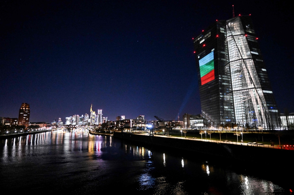 A projection of Bulgaria's national flag is pictured on the facade of the European Central Bank (ECB) headquarters in Frankfurt am Main December 30, 2025 as a preview of the ECB main building illumination in celebration of Bulgaria’s accession to the euro area. — AFP pic 