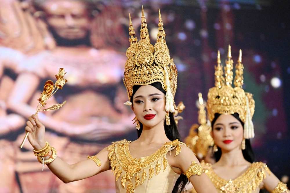 This photo taken on December 6, 2025 shows Cambodian students from the Secondary School of Fine Arts performing a dance routine during the Cambodia-International Construction Industry Expo in Phnom Penh. But after barely surviving Cambodia's genocidal Khmer Rouge regime in the 1970s, it is now under threat from a changing media and entertainment landscape, limited funding and economic challenges. — AFP pic 