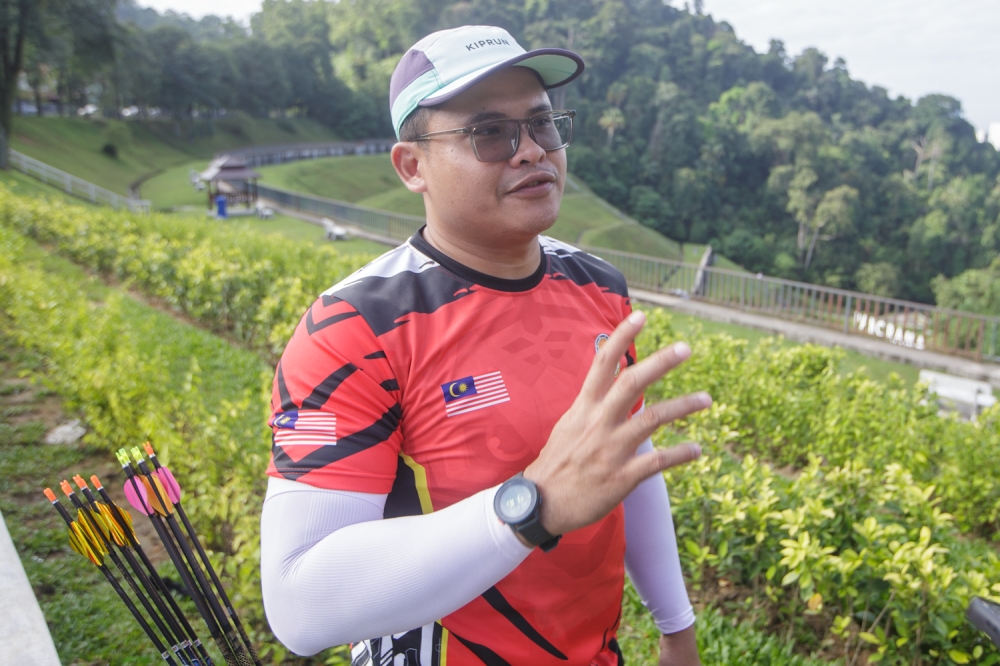 Johor school teacher Mohamed Rizal Sarip speaks to Malay Mail during the National Field Archery Championship at Panorama, Bukit Antarabangsa, Hulu Kelang, Ampang December 20, 2025. — Picture by Raymond Manuel