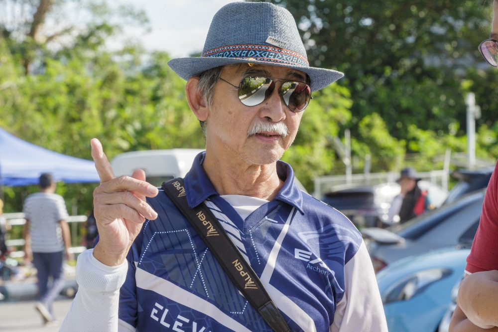 Senior sales and technician advisor Tan Peng Loon speaks to Malay Mail during the National Field Archery Championship at Panorama, Bukit Antarabangsa, Hulu Kelang, Ampang December 20, 2025 — Picture by Raymond Manuel