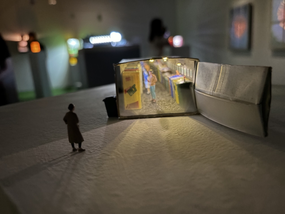 Hong Kong artist Sim Chan’s artwork titled ‘Recycling’s shows vending machines on one side and trash on another. — Picture by Opalyn Mok